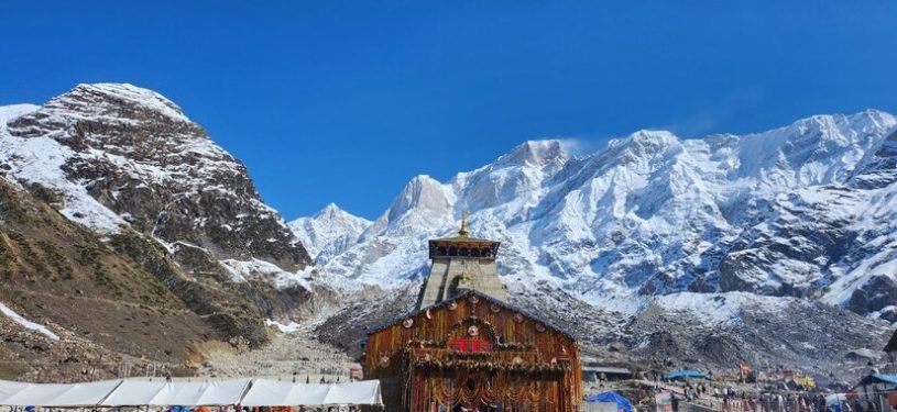 crowd-people-front-temple-with-snow-covered-mountains-background_908348-9